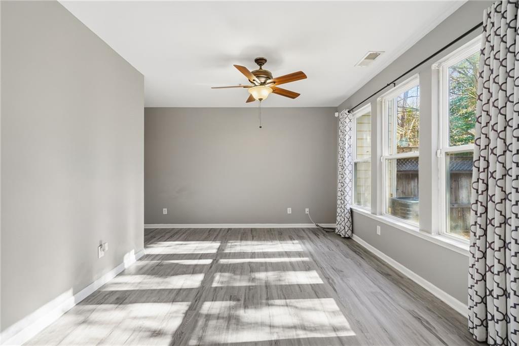 331 Oakview Way Canton, GA 30114 - Photo 19 of 42 wooden floor in an empty room with a window