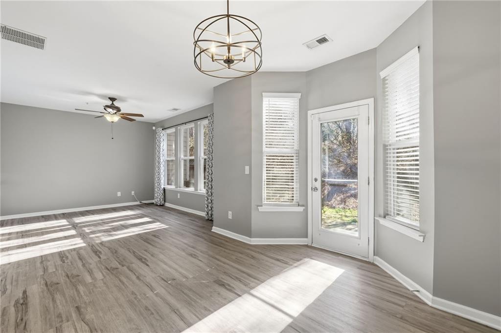 331 Oakview Way Canton, GA 30114 - Photo 21 of 42 a view of an empty room with wooden floor and window