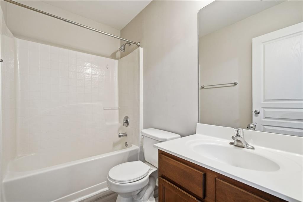 331 Oakview Way Canton, GA 30114 - Photo 26 of 42 a bathroom with a sink a toilet and shower