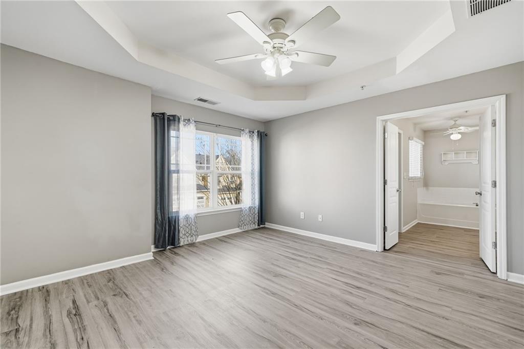 331 Oakview Way Canton, GA 30114 - Photo 29 of 42 an empty room with wooden floor and window