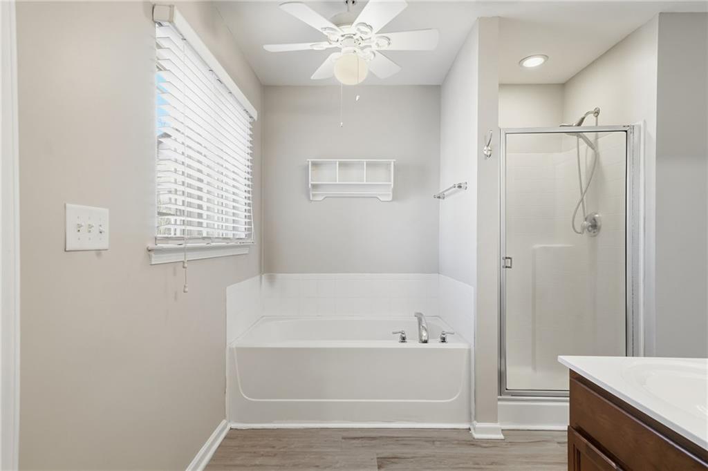 331 Oakview Way Canton, GA 30114 - Photo 31 of 42 a bathroom with a bathtub and a shower