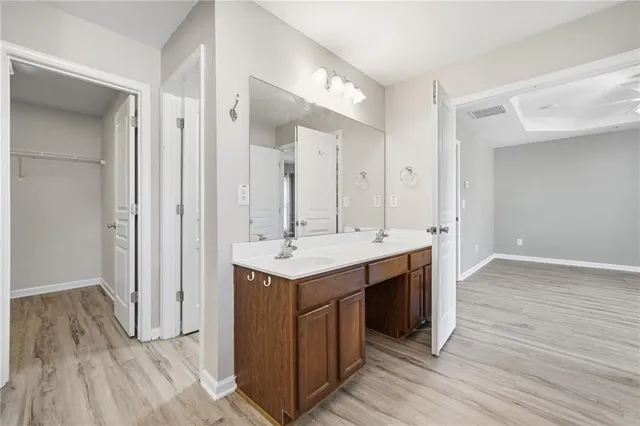 an view bathroom with a sink a mirror and a shower
