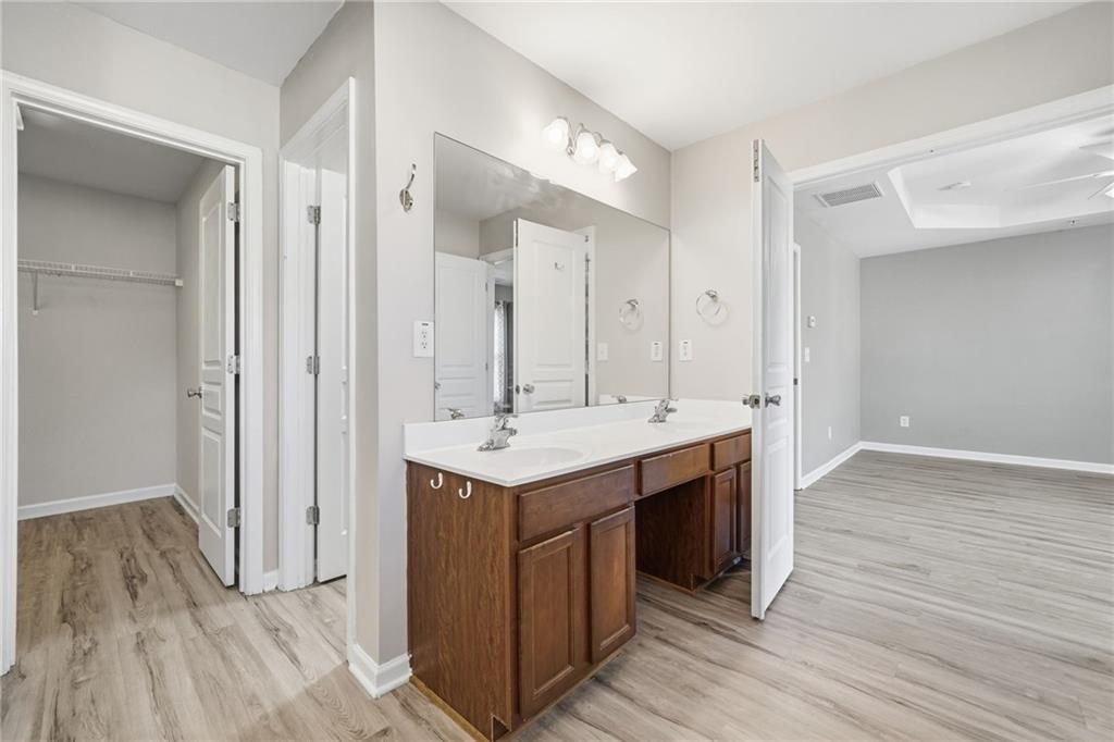 331 Oakview Way Canton, GA 30114 - Photo 32 of 42 an view bathroom with a sink a mirror and a shower