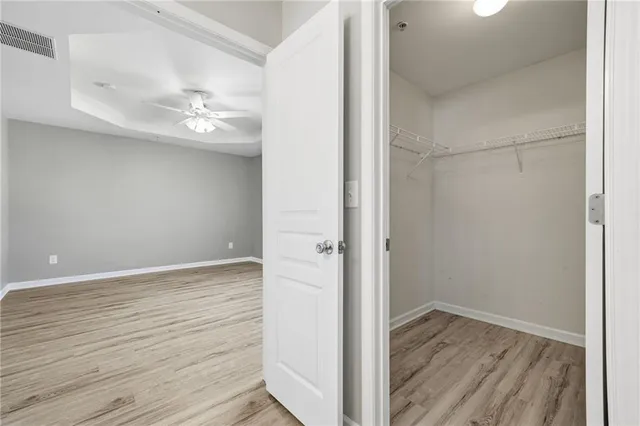 a view of a room with wooden floor