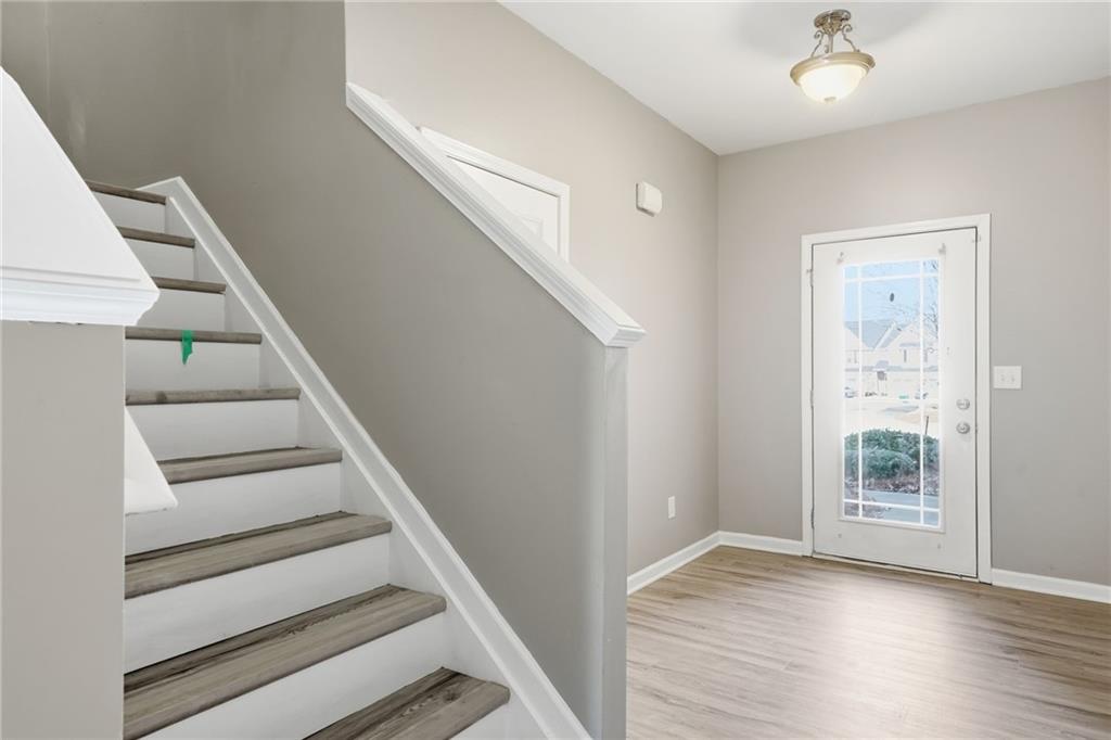331 Oakview Way Canton, GA 30114 - Photo 6 of 42 a view of entryway and hall with wooden floor