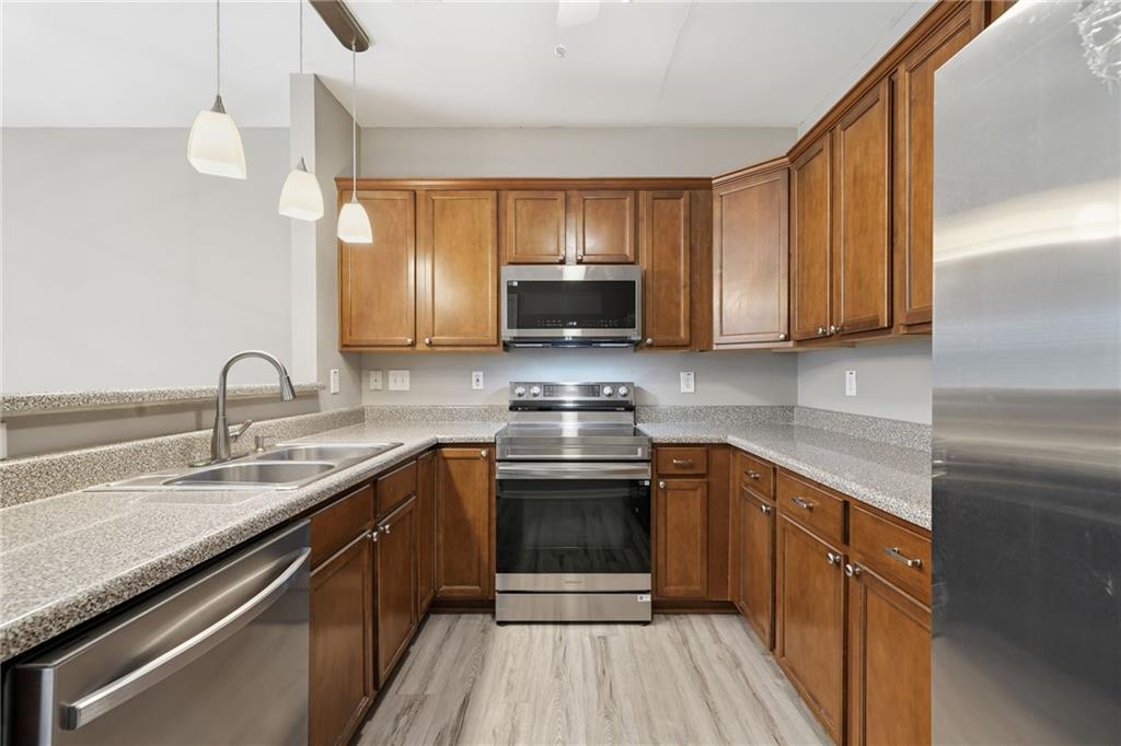 331 Oakview Way Canton, GA 30114 - Photo 9 of 42 a kitchen with a sink stove and cabinets