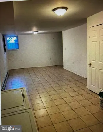 a white toilet sitting next to a bath tub and a sink
