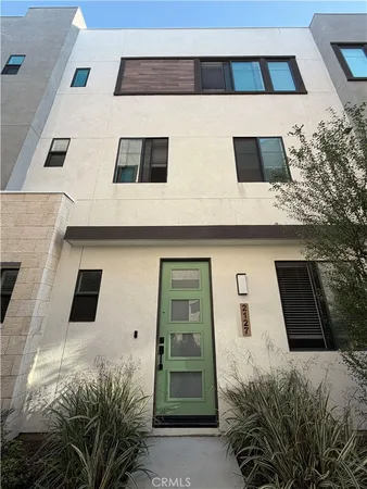 a kitchen with stainless steel appliances a sink a stove and a refrigerator