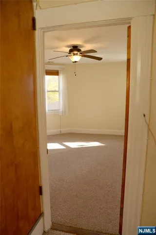 a view of a room with a hallway