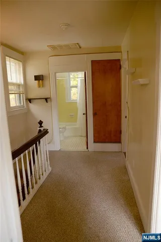 a view of a hallway with windows