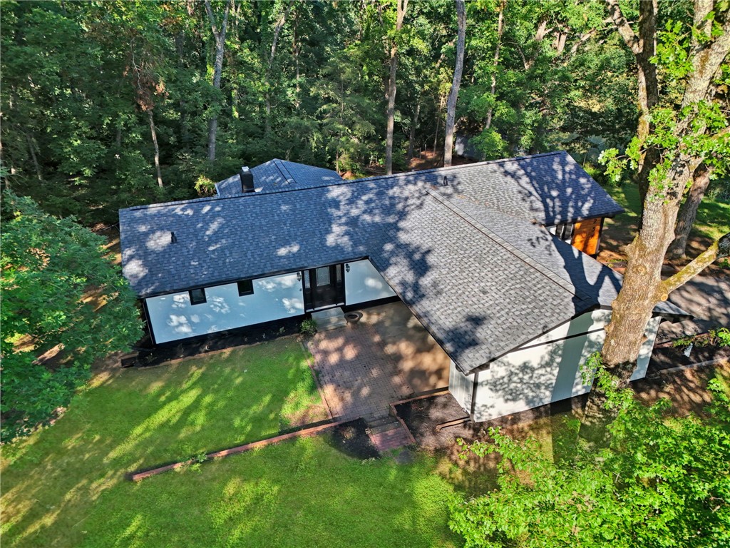237 Earle Road Central, SC 29630 - Photo 22 of 24 An aerial perspective reveals the home nestled among a lush, verdant treeline with a well-maintained lawn.
