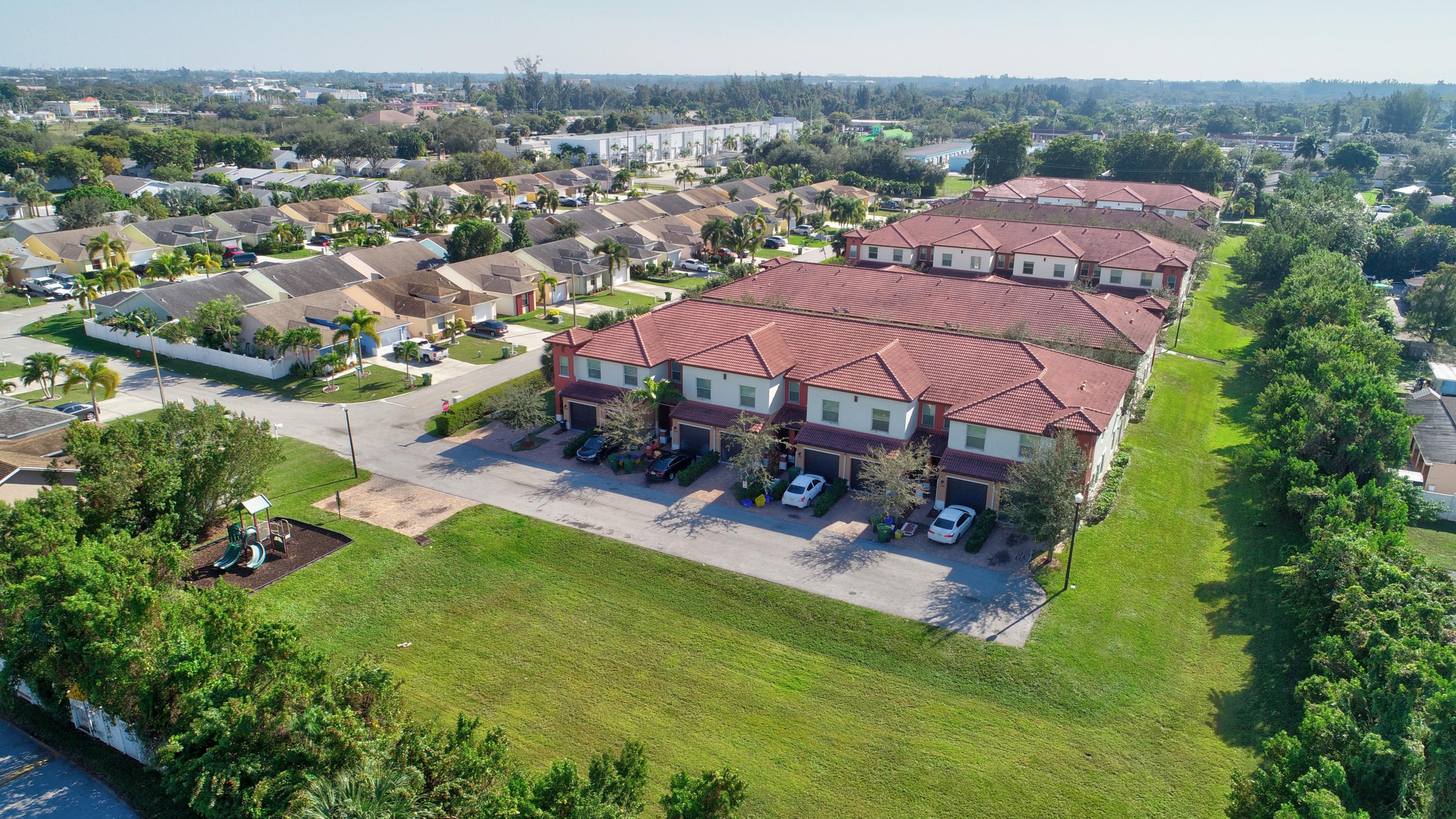 116 Williams Court Palm Springs, FL 33461 - Photo 15 of 17 an aerial view of a house with garden space and lake view