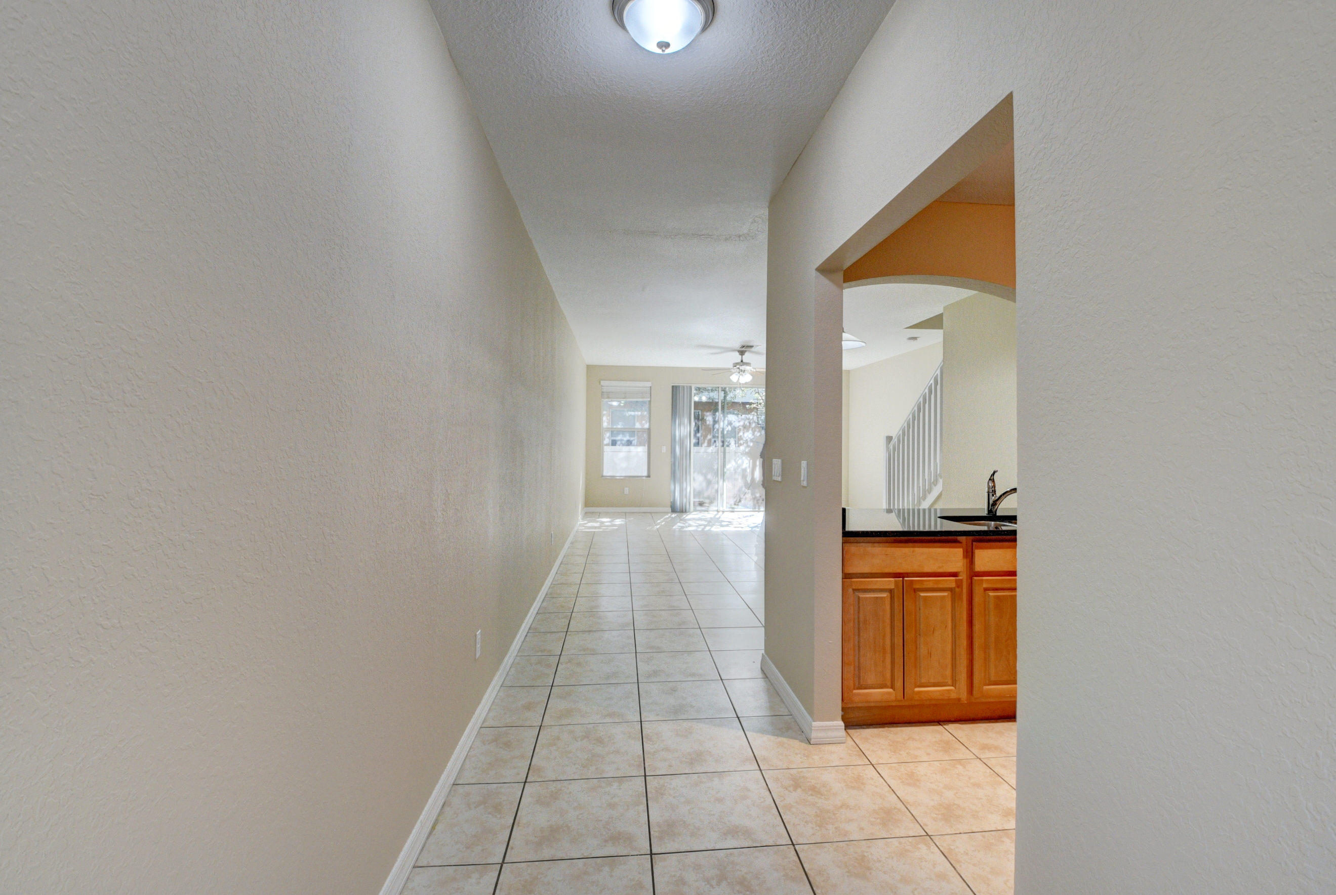 116 Williams Court Palm Springs, FL 33461 - Photo 5 of 17 wooden floor in a hall with an entryway