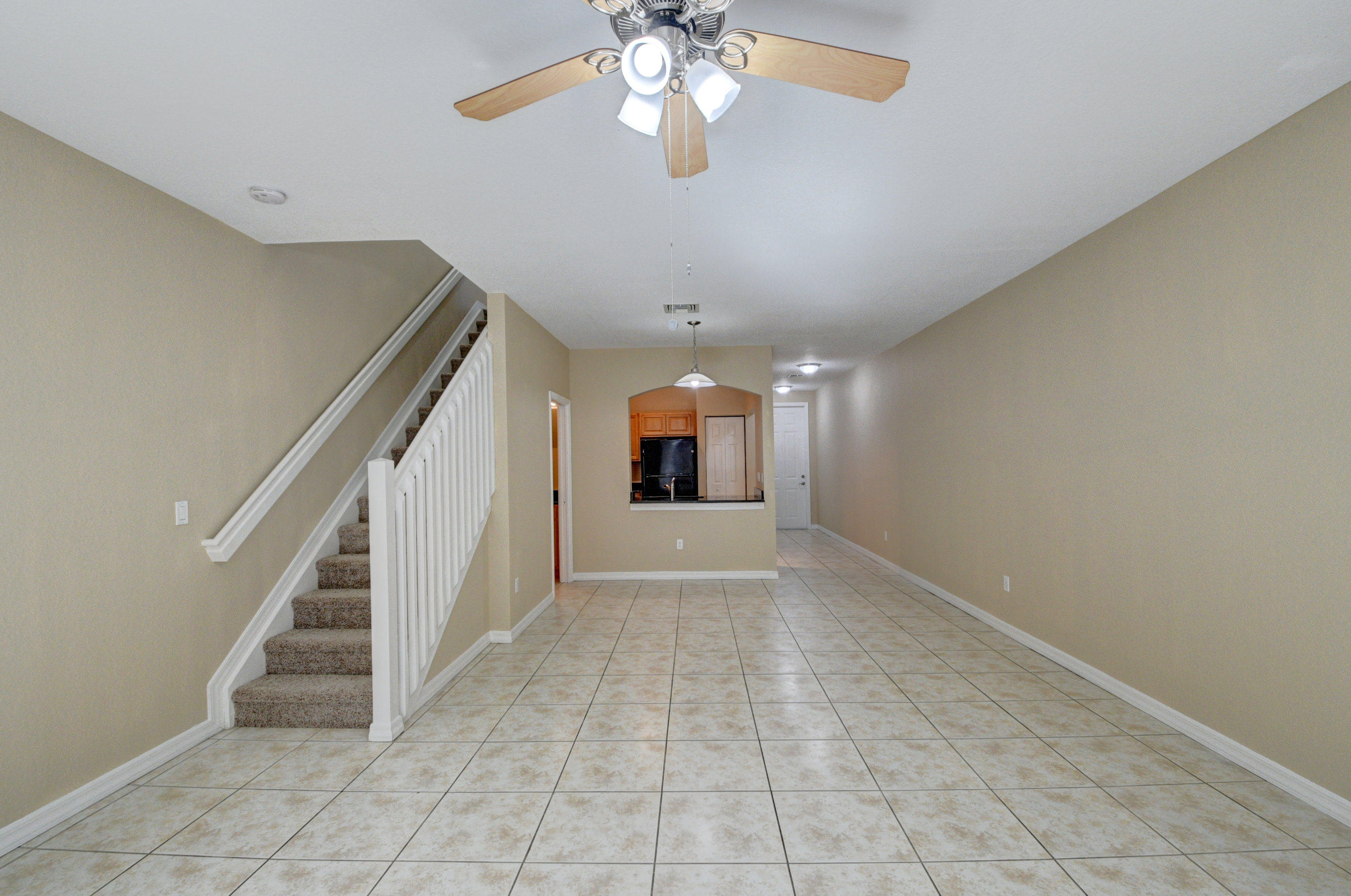 116 Williams Court Palm Springs, FL 33461 - Photo 7 of 17 a view of entryway and hall with a chandelier