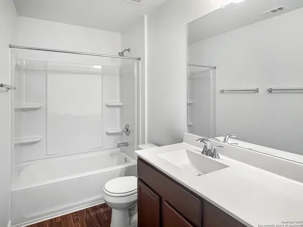 a bathroom with a sink a toilet and a bathtub