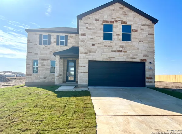 a front view of a house with yard
