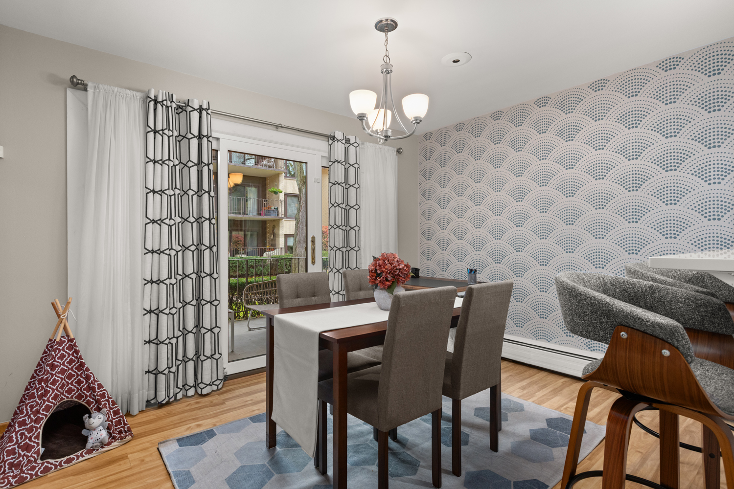 1029 Washington Boulevard, Unit 102 Oak Park, IL 60302 - Photo 12 of 24 a view of a dining room with furniture and chandelier