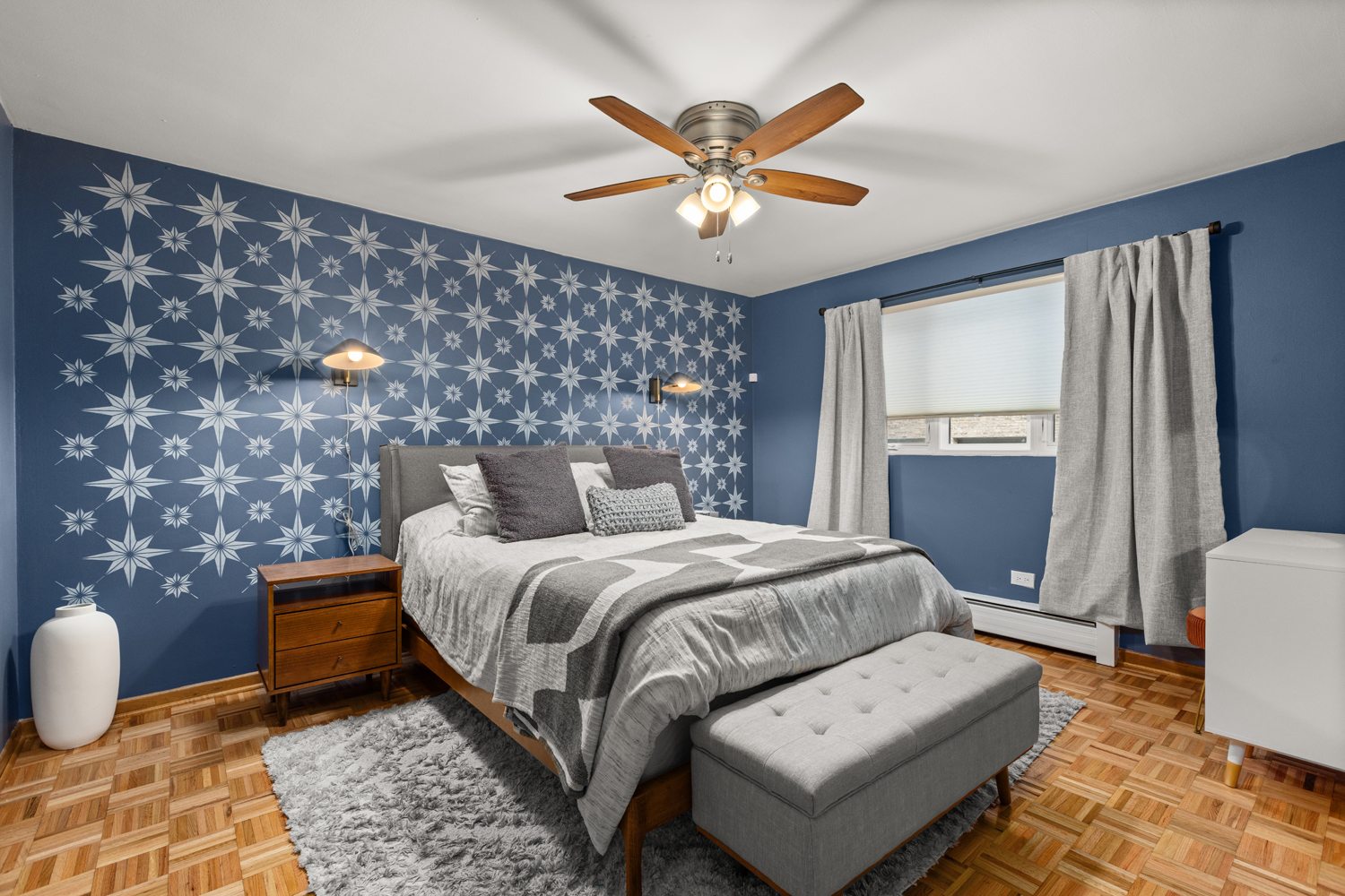 1029 Washington Boulevard, Unit 102 Oak Park, IL 60302 - Photo 14 of 24 a bedroom with a bed and a chandelier