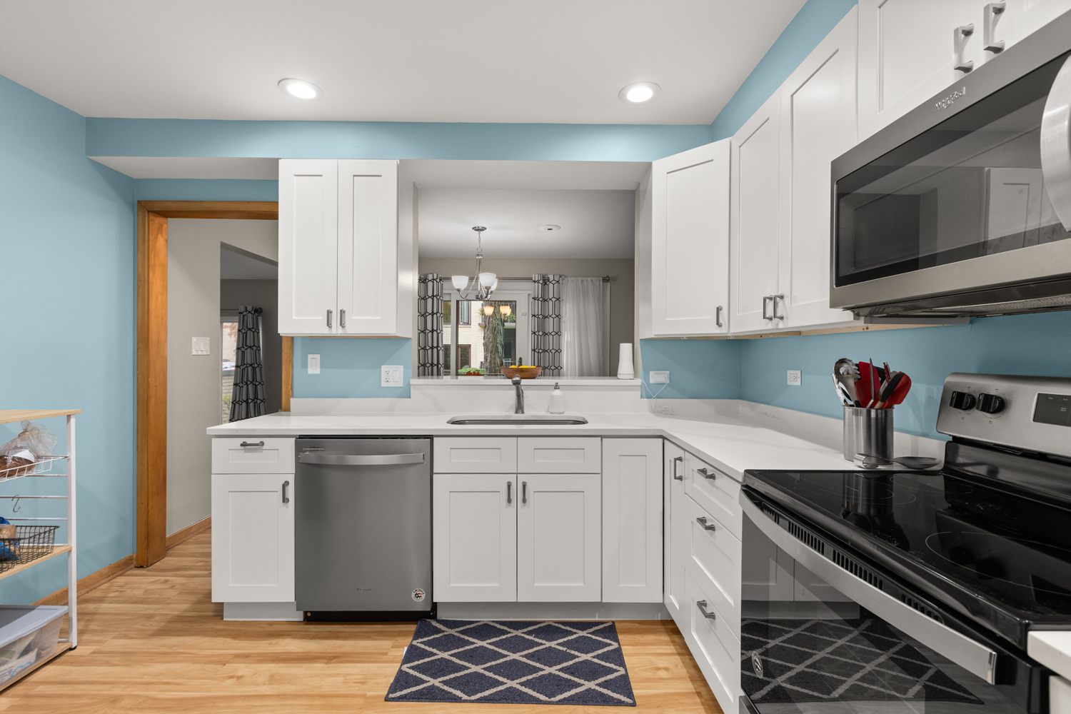 1029 Washington Boulevard, Unit 102 Oak Park, IL 60302 - Photo 9 of 24 a kitchen with stainless steel appliances granite countertop a sink stove and cabinets