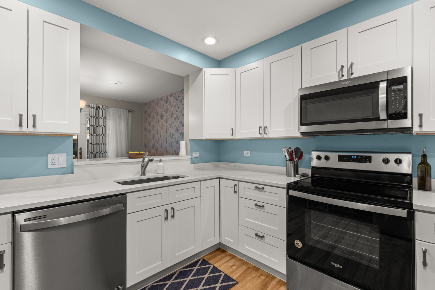 1029 Washington Boulevard, Unit 102 Oak Park, IL 60302 - Photo 10 of 24 a kitchen with a sink stove and microwave