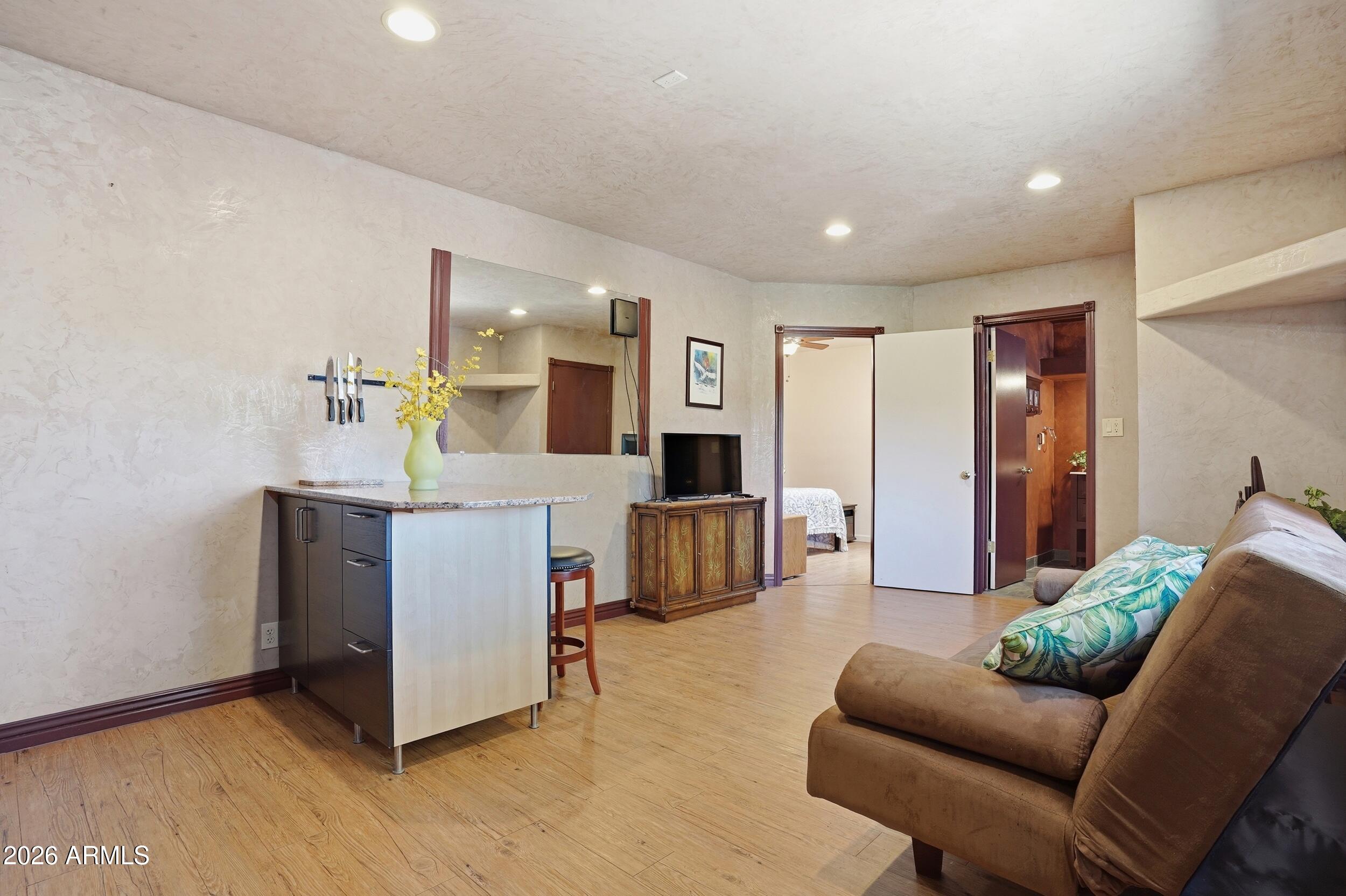 6334 East Albany Street Mesa, AZ 85205 - Photo 52 of 72 a living room with furniture and a kitchen