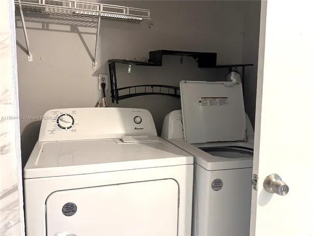 a view of front door of house with yard