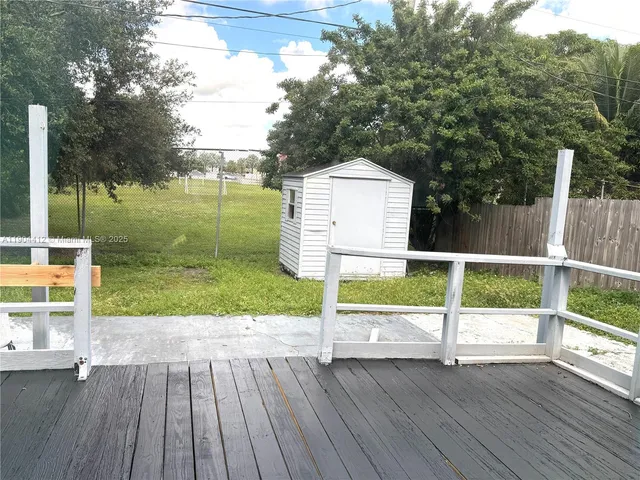an empty room with closet and a bathroom
