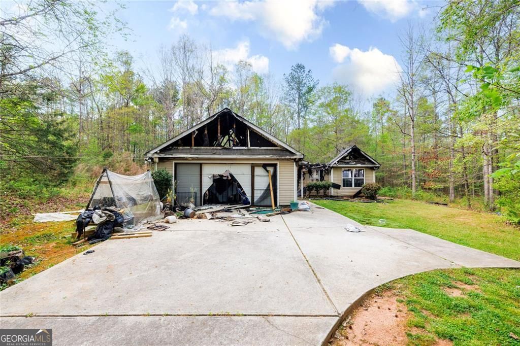 210 Whitehead Drive Covington, GA 30016 - Photo 1 of 1 a front view of a house with yard porch and garage