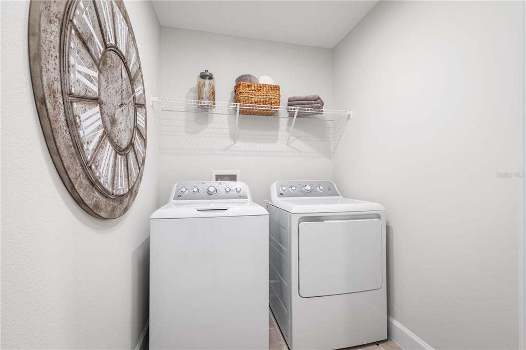 436 Elm Spg Road St. Cloud, FL 34771 - Photo 14 of 14 a utility room with dryer and washer