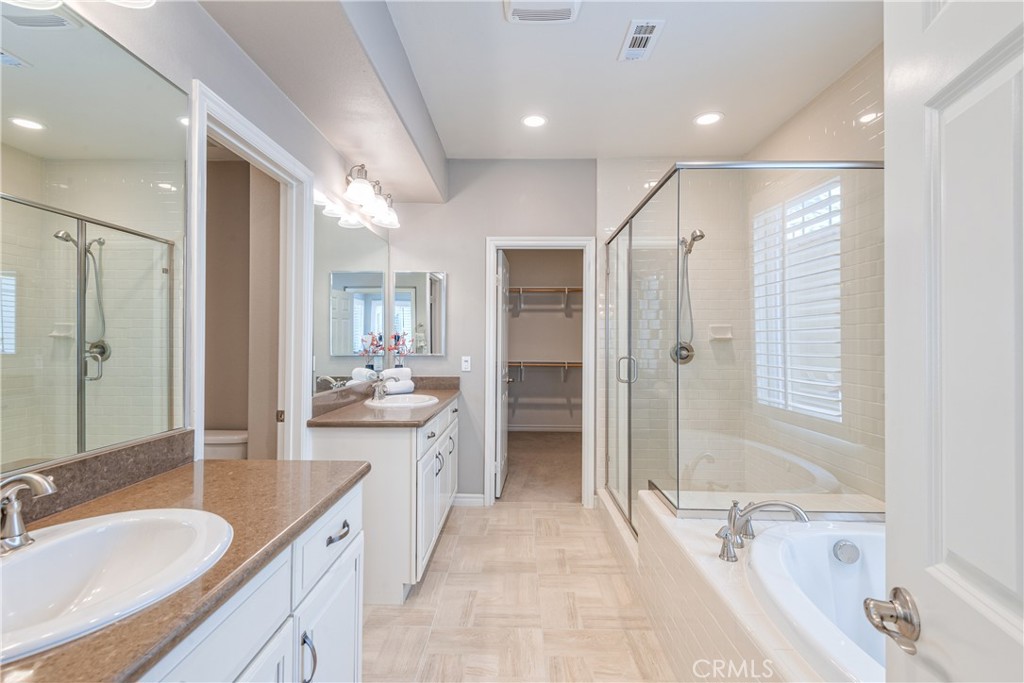 120 Mongoose Irvine, CA 92618 - Photo 10 of 42 a bathroom with a granite countertop tub sink shower and mirror