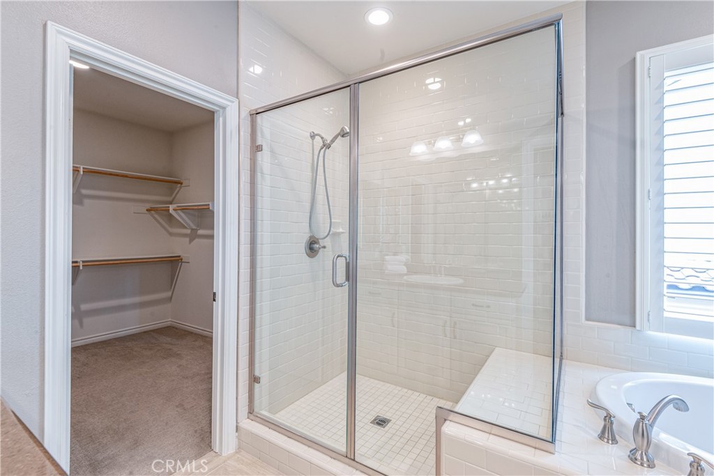 120 Mongoose Irvine, CA 92618 - Photo 11 of 42 a bathroom with a shower and a tub