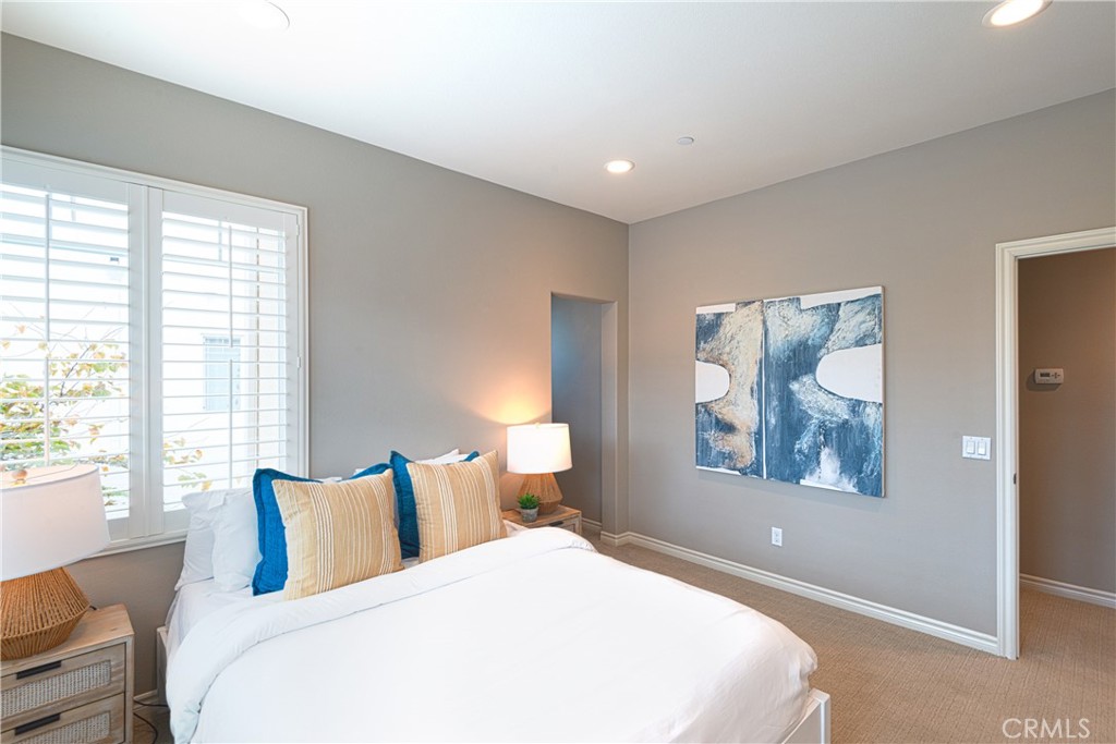 120 Mongoose Irvine, CA 92618 - Photo 24 of 42 a bedroom with a large bed and a window