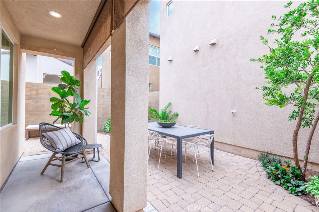 120 Mongoose Irvine, CA 92618 - Photo 30 of 42 a view of a entryway with wooden floor and a bench