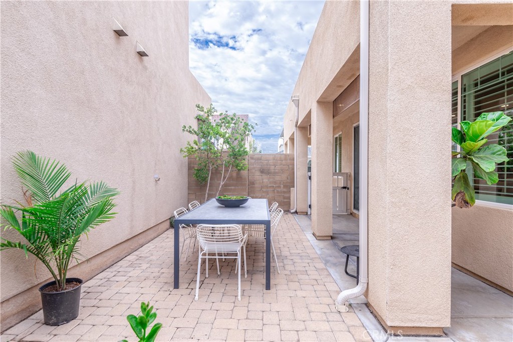 120 Mongoose Irvine, CA 92618 - Photo 31 of 42 a view of a house with backyard and sitting area