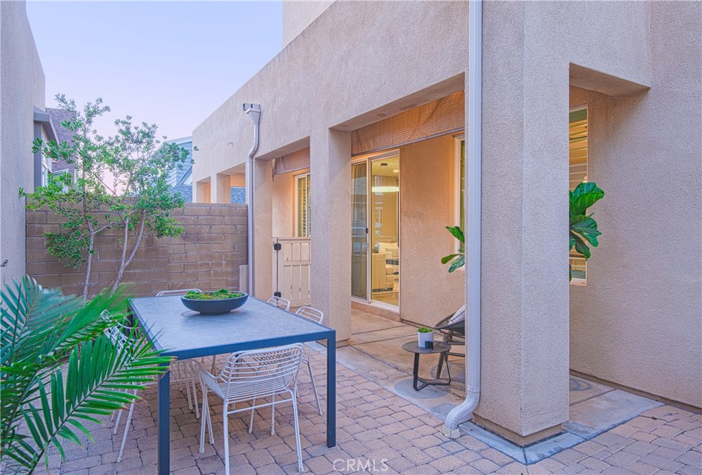120 Mongoose Irvine, CA 92618 - Photo 33 of 42 a view of a dining room with furniture and wooden floor