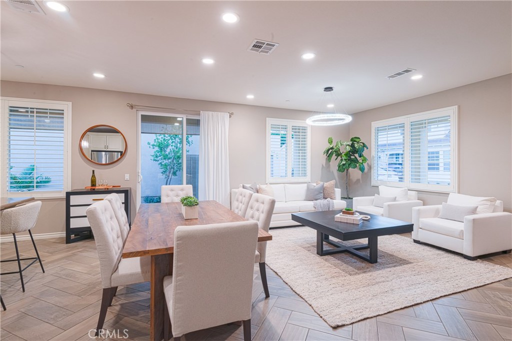 120 Mongoose Irvine, CA 92618 - Photo 39 of 42 a living room with fireplace furniture and a large window