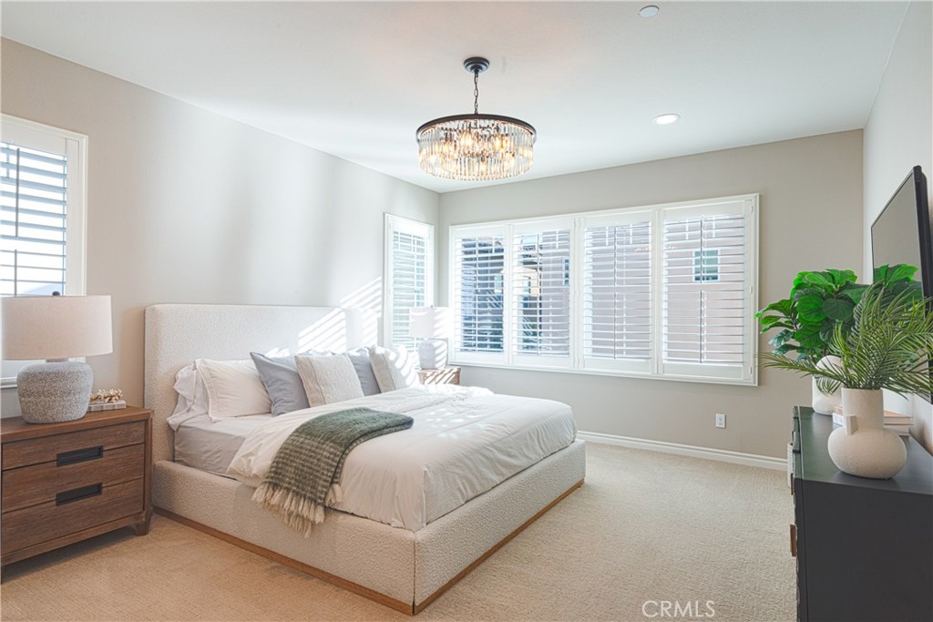 120 Mongoose Irvine, CA 92618 - Photo 3 of 42 a spacious bedroom with a bed and a window