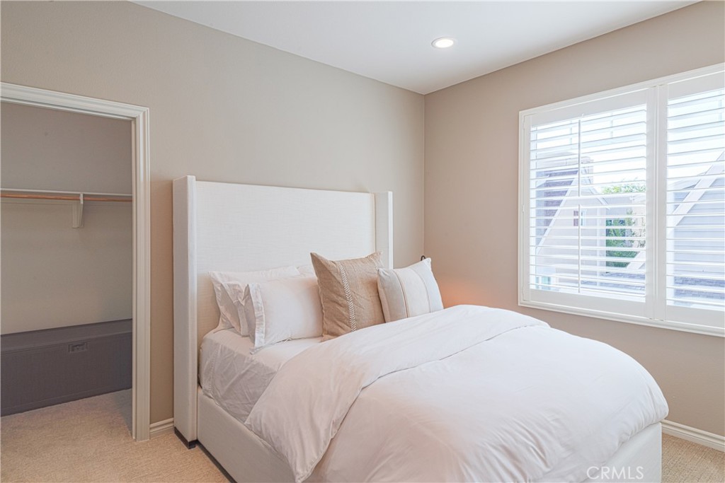 120 Mongoose Irvine, CA 92618 - Photo 5 of 42 a bedroom with a large bed and a large window