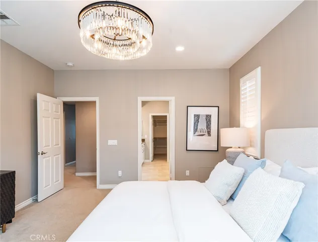 a bedroom with bed and window