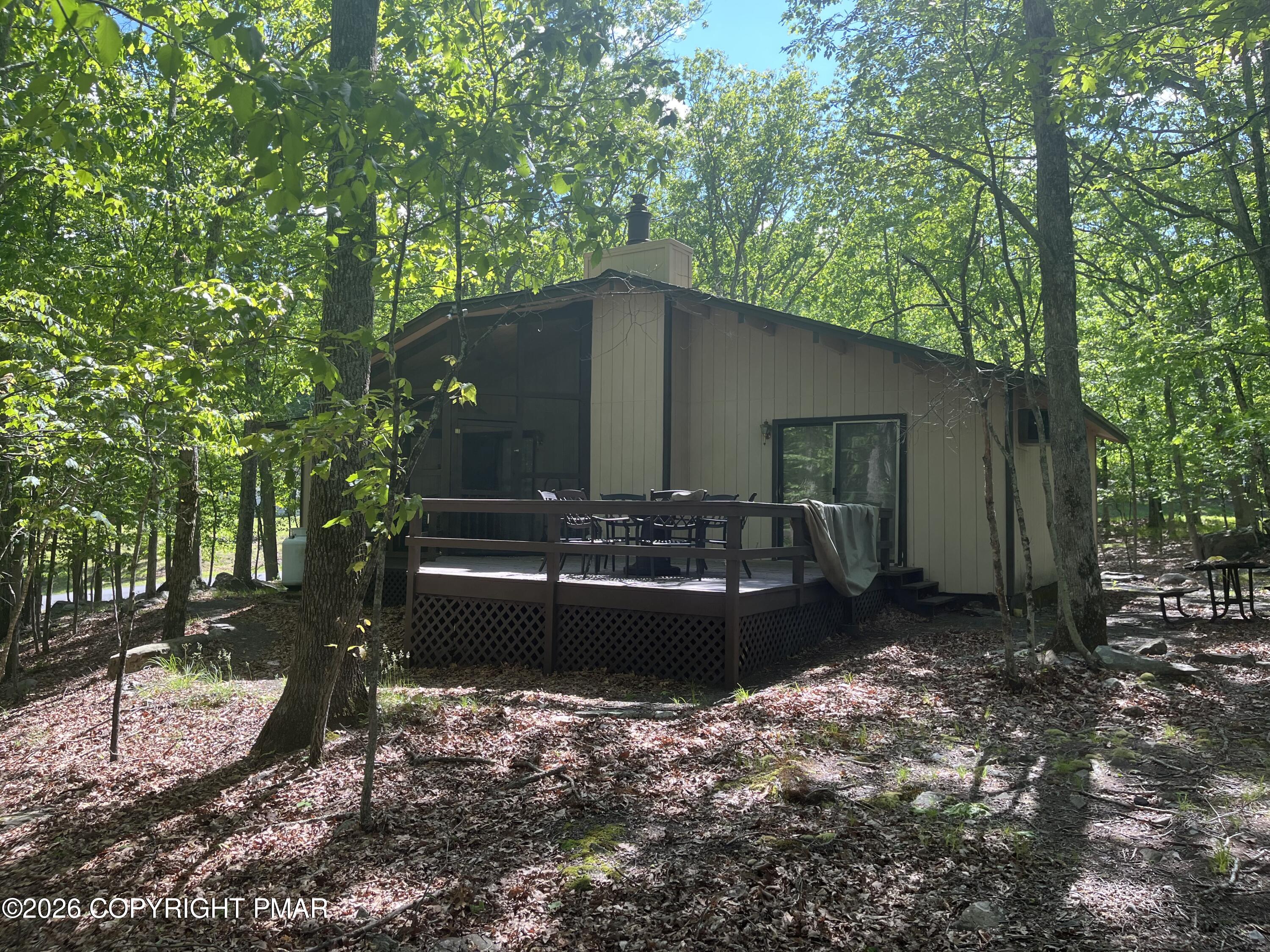 5970 Decker Road Bushkill, PA 18324 - Photo 6 of 26 a front view of a house with garden