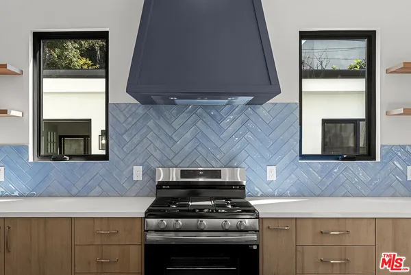 a kitchen with a stove and a microwave