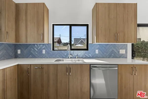 a view of a sink and a window