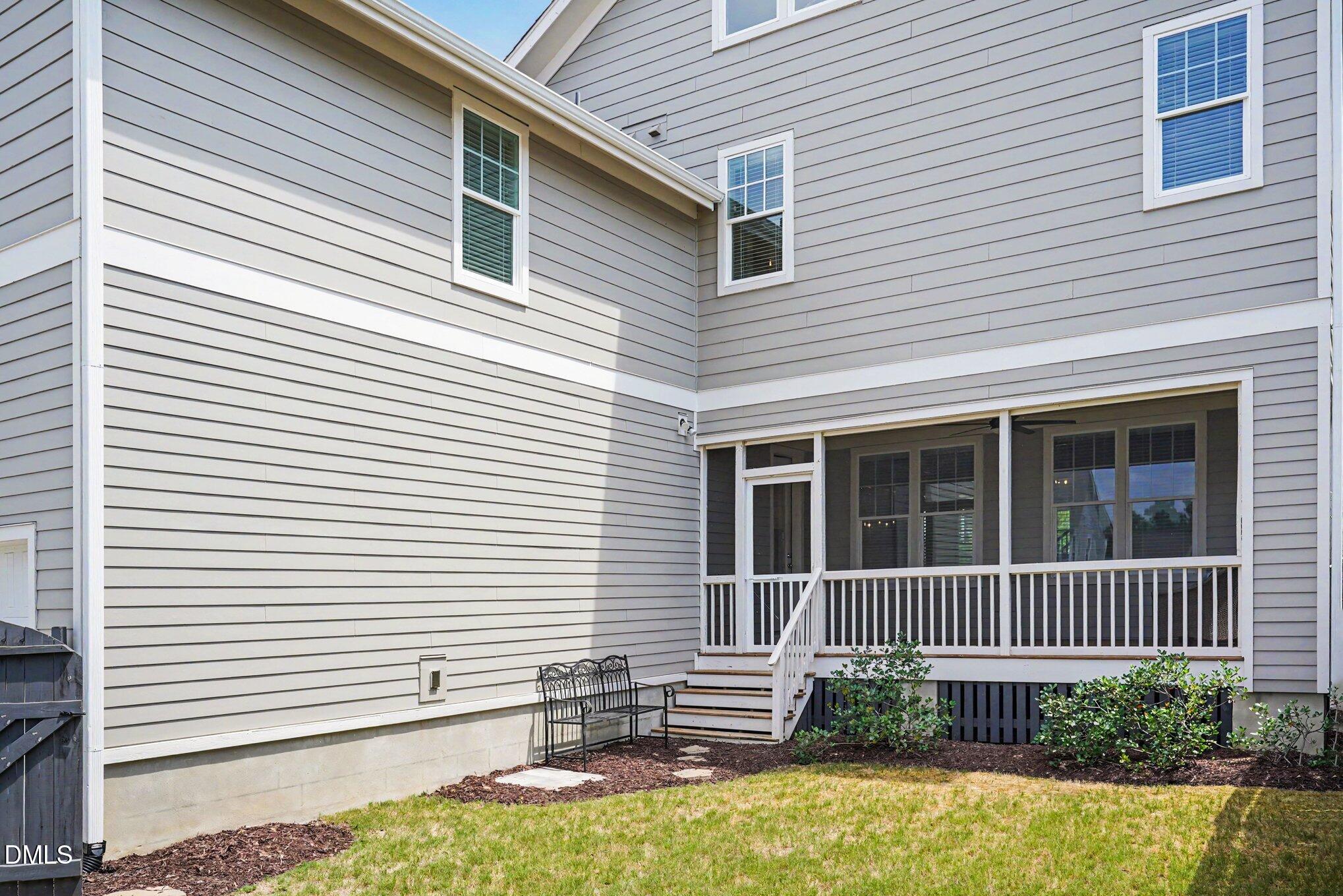 824 Watercolor Way Durham, NC 27713 - Photo 24 of 28 a view of a house with a small yard and a large window