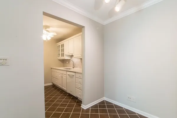 a room with walk in closet and window