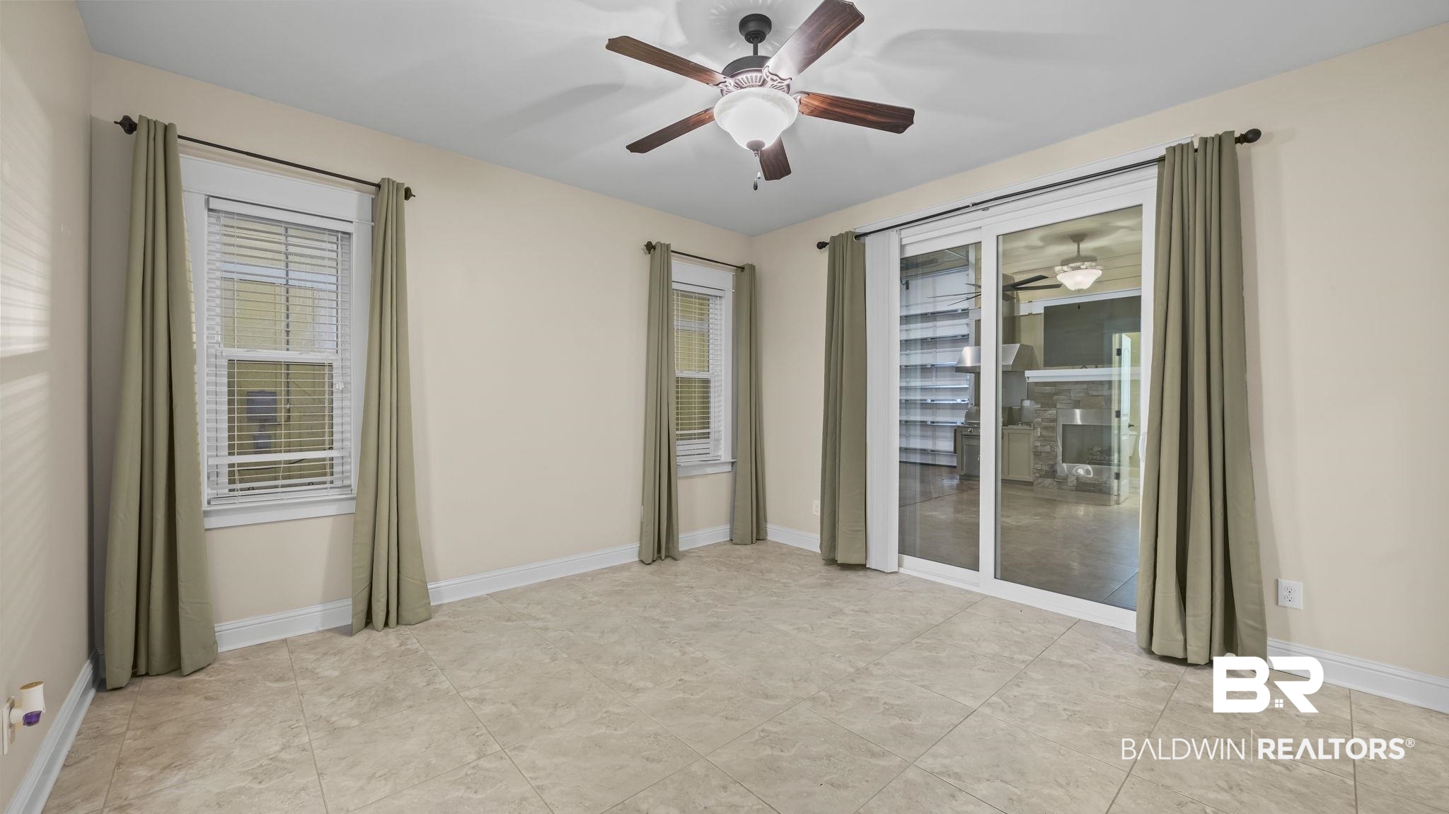 12361 Reunion Place Foley, AL 36535 - Photo 19 of 43 Spare room featuring baseboards and a ceiling fan