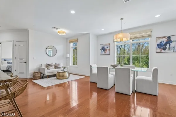 a living room with furniture window and wooden floor