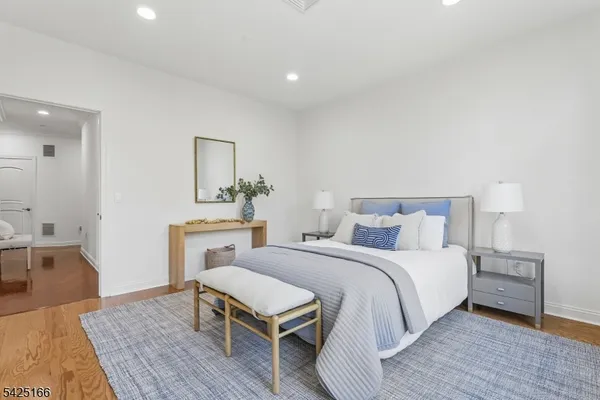 a bedroom with a bed and a table