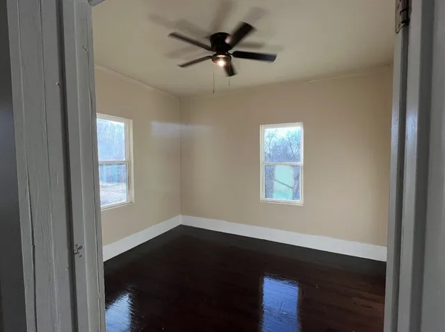 a view of an empty room with a window