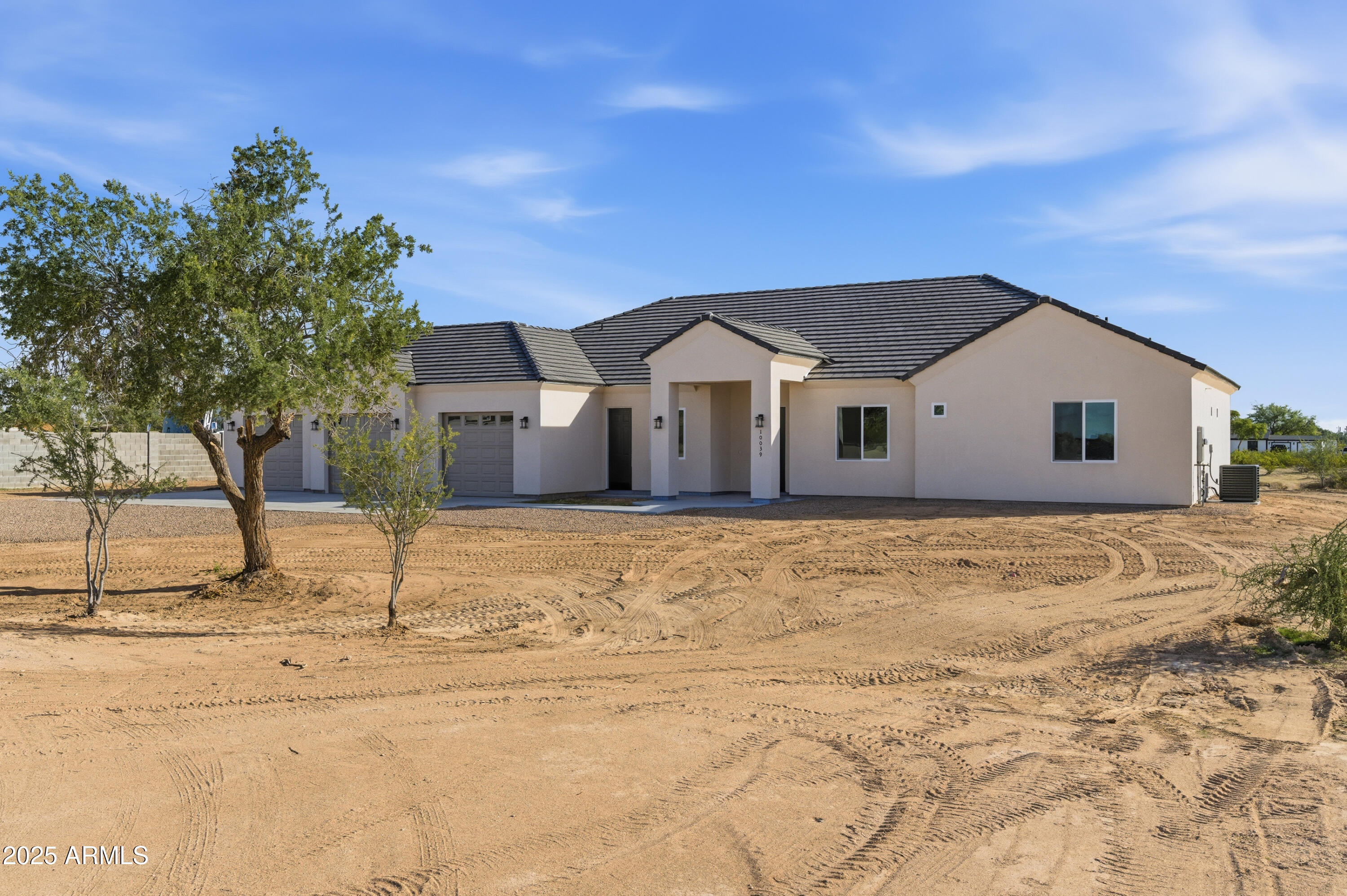10039 North Burris Road Casa Grande, AZ 85122 - Photo 3 of 61 a front view of a house with a yard