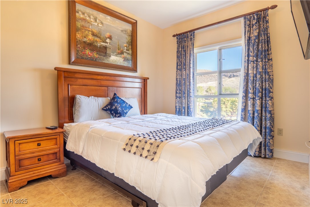 30 Strada Di Villaggio, Unit 617 Henderson, NV 89011 - Photo 14 of 34 Bedroom with baseboards and light tile patterned floors
